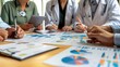 © Naknakhone - Healthcare consultancy meeting, medical professionals discussing patient care innovations, charts and graphs on display, clinical setting. copy space for text.