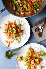 Two Plates / Servings of Cashew Chicken and Rice with peppers and snow peas