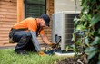 © Gophotograph - Close-up shot of an HVAC technician working on a heat pump, highlighting the intricate details and precision required for efficient repair.
