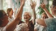 © Evarelle - A joyful scene captures elderly women enthusiastically raising their hands in celebration. For use in healthcare, senior living advertisements, social media, and community engagement campaigns