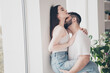 © deagreez - Photo of happy young couple move new place enjoy live together husband hold wife kiss neck new apartment room light house flat indoor