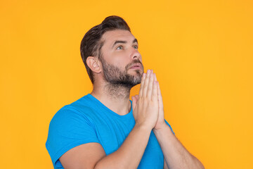 Male prayer. Man praying. Isolated portrait of male pray. Guy with praying hands. The religious fervor. Concept for religion, faith, prayer and spirituality.