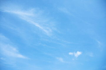Wall Mural - blue sky background and white clouds soft focus, and copy space horizontal shape.