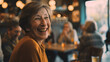 © VK Studio - Elderly woman with an infectious smile enjoying a warm, joyful moment in a cozy cafe, surrounded by soft lighting and blurred background patrons.