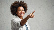 © Eetu - Confident Professional Woman with Afro Hair Smiling and Pointing