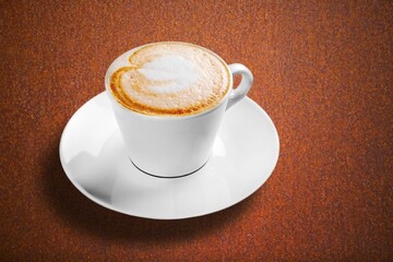 Sticker - Cup of tasty hot coffee on wooden desk