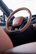 © Steve - Close-up of the steering wheel of a new energy electric car