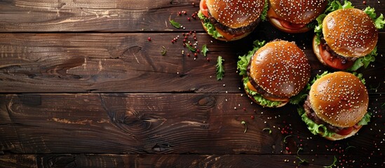 Poster - Burgers made at home displayed on a vintage wooden surface with copy space image
