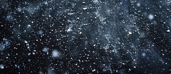 Aufkleber - A wide photo featuring snow falling on asphalt from above with copy space image