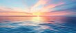 © meristock - Picturesque sunset with a clear blue sky and a colorful horizon reflecting on a calm ocean seascape in a copy space image