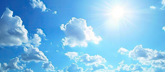 Aufkleber - Bright sun in a blue sky with white clouds and room for a copy space image