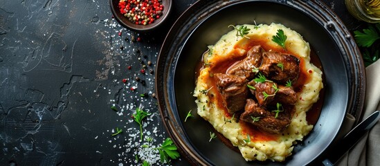 Poster - Delicious beef tongue served with creamy mashed potatoes in the dish ideal for any food photography with a copy space image