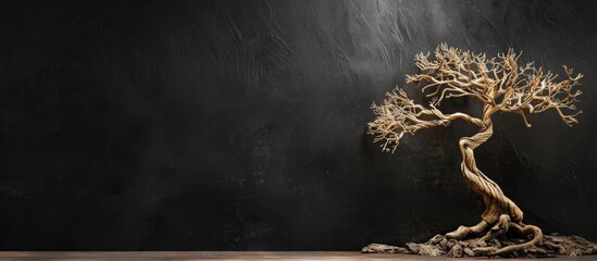 Aufkleber - Decorative wooden tree on a black background with copy space image