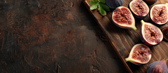Poster - Slice ripe figs on a wooden cutting board for a rustic kitchen scene with copy space image