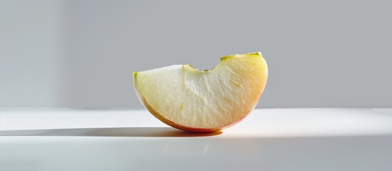 Poster - A succulent apple slice displayed against a white backdrop with copy space image