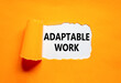 © Dzmitry - Adaptable work symbol. Concept words Adaptable work on beautiful white paper. Beautiful orange paper background. Business Adaptable work concept. Copy space.