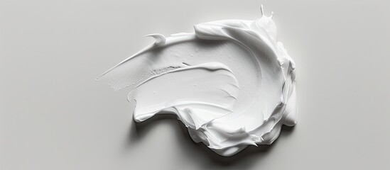 Poster - Skin care cream in a smooth texture spread on a white background for a copy space image