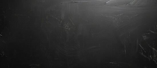 Fototapete - Texture of a black chalkboard providing a background for adding custom text to the copy space image