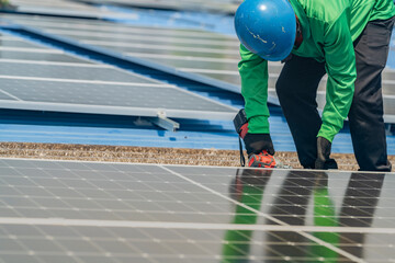 Wall Mural - Worker Technicians are working to construct solar panels system on roof. Installing solar photovoltaic panel system. Men technicians walking on roof structure to check photovoltaic solar modules.