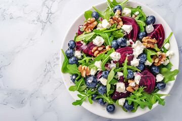 Poster - Delicious salad with sweet beets, blueberries, feta cheese, arugula and walnuts, with empty copy Space, light marble table background, top view