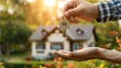 © jirayut - Celebratory Moment: Real Estate Agent Passing House Keys to Happy New Homeowner