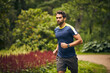 © Leffy/peopleimages.com - Morning, exercise and man in park for running challenge, wellness and healthy outdoor fitness. Training, cardio and runner on path in nature with commitment, progress and athlete in muscle workout.