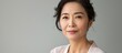 © Ilgun - Middle aged Asian lady in a beauty portrait showcasing skincare and cosmetics with a copyspace image