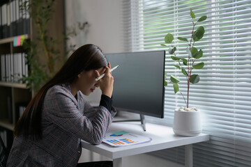 Poster - Stressed Businesswoman Working at Desk with Computer and Documents in Modern Office