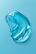 © markusmiller - Sharp photo of an isolated liquid gel smear a blue background, resembling transparent aloe lotion
