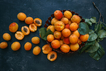 Wall Mural - Large wooden plate with apricots, summer harvest concept