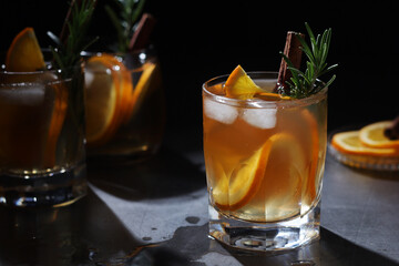 Wall Mural - Orange rosemary bourbon cocktail in low key	