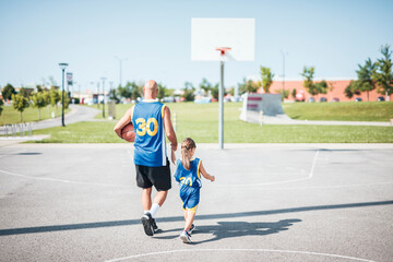 Wall Mural - Basketball, sport with a dad and daughter training on a court outside for leisure fitness and fun