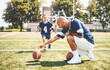 © Louis-Photo - football, sport with a dad and daughter training on a court outside for leisure fitness and fun
