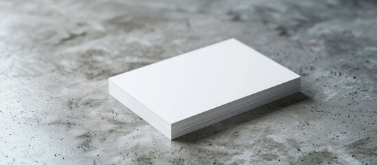 Wall Mural - Close up mockup of blank business cards on a light grey textured table with copy space image