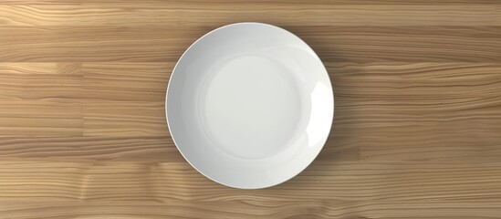 Canvas Print - Top view of a white ceramic plate on wooden table with copy space image