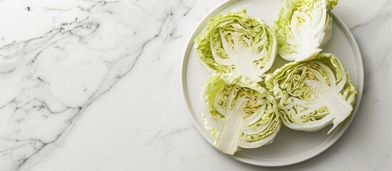 Sticker - A plate with sliced cabbage on a white background showcasing a copy space image Exploring the benefits of this healthy vegetable option