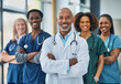© oneli - Team of Smiling Medical Professionals with Clipboards