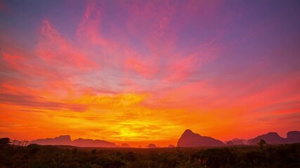 Fototapete - Time lapse Amazing light of nature cloudscape sky above Samed Nang Chee islands in Phang Nga.
Imagine a fantasy bright red sky at sunrise.
tropical landscape background.fantasy red clouds in sunrise