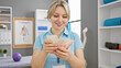 © Krakenimages.com - Young, caucasian woman counting israeli shekels in a rehabilitation clinic room.