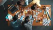 © InfiniteFlow - Time lapse of business team with casual outfit looking laptop screen and sharing idea. Aerial view of manager working and checking color palette at table with sticky notes and headphone. Symposium.
