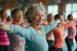 © zphoto83 - Group of senior women participating in a morning exercise class at a community center
