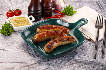 Poster - Delicous natural roasted sausages in the plate