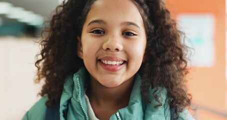 Poster - Girl, child and happy with face at school with backpack in corridor for education, knowledge and academy. Kid, portrait and bag in hallway for progress, learning and smile for future in Colombia