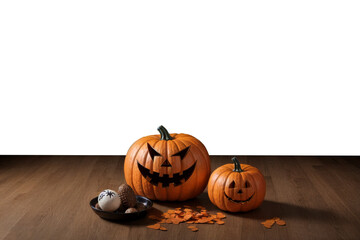 Two carved pumpkins showcasing Halloween spirit on wooden floor, empty isolated background