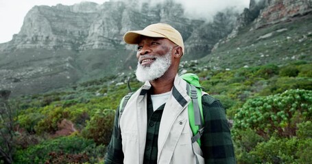 Canvas Print - Senior man, backpack and smile in mountains with hiking, adventure and view in nature. Outdoor, camping and travel with retirement vacation and African person with peace and gratitude of wellness