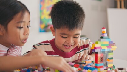 Wall Mural - A boy is holding a toy with a number of faces on it