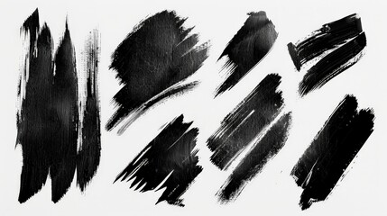 Aufkleber - A collection of various artistic black brush strokes is presented on a white canvas, showcasing different brush techniques and textures often used in painting and graphic design.