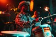 © Tetiana - Bongo drummer on stage with conga drums during jazz rock show tumbadora quinto with latin afro cuban band in background