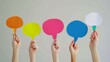 © Ace64 Studio - People are holding colorful speech bubbles.