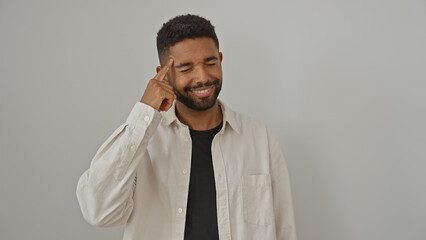 Sticker - A young adult black man touches his head, smiling with eyes closed, isolated on a white background.